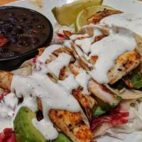 Baja Fish Tacos · Grilled or deep-fried haddock in masa tortillas with Baja honey-lime slaw, avocado and pico ...
