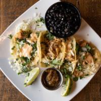 Poblano Pork Tacos · Barbacoa pulled pork in masa tortillas, white onion, cilantro and jack cheese drizzled with ...