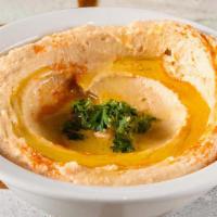 Original Hummus · Steamed garbanzo beans with lemon juice, garlic, salt, pepper & tahini drizzled with olive o...