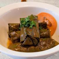 Veggie Grape Leaves (4Pcs)  (V,Gf) · Grape leaves stuffed with bell peppers, rice and pomegranate molasses. Served with tahini sa...
