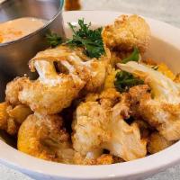 Arnabeet · Lightly salted, golden brown, fried cauliflower with a side of tahini sauce. Vegan. Vegetari...