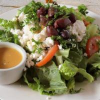 Greek Salad (Gf) · Romaine lettuce with tomato, parsley, cucumber, feta cheese, olives, and house dressing.