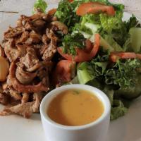 Chicken Shawarma Salad · Grilled chicken shawarma marinated with sautéed onions over crispy romaine lettuce, tomatoes...