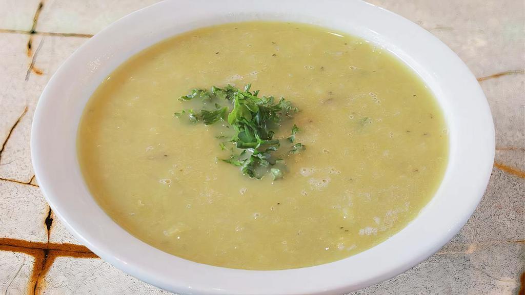Lentil Soup · Our traditional soup with red lentils, green peas, rice, and potato’s steamed with veggie broth. Served with pita bread. Vegan. Vegetarian. Gluten free.