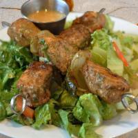 Chicken Kabob Salad · Grilled chicken breast skewers with onions & bell peppers over crispy romaine lettuce, tomat...