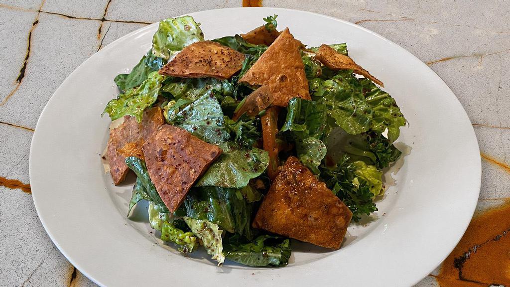Fattoush · Romaine lettuce, tomatoes, cucumbers, parsley, sumac, pita chips with a tangy pomegranate molasses dressing. New!