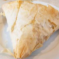 Spanakopita · Flakey organic philo dough stuffed with feta cheese, ricotta cheese, spinach, and onions. Ve...