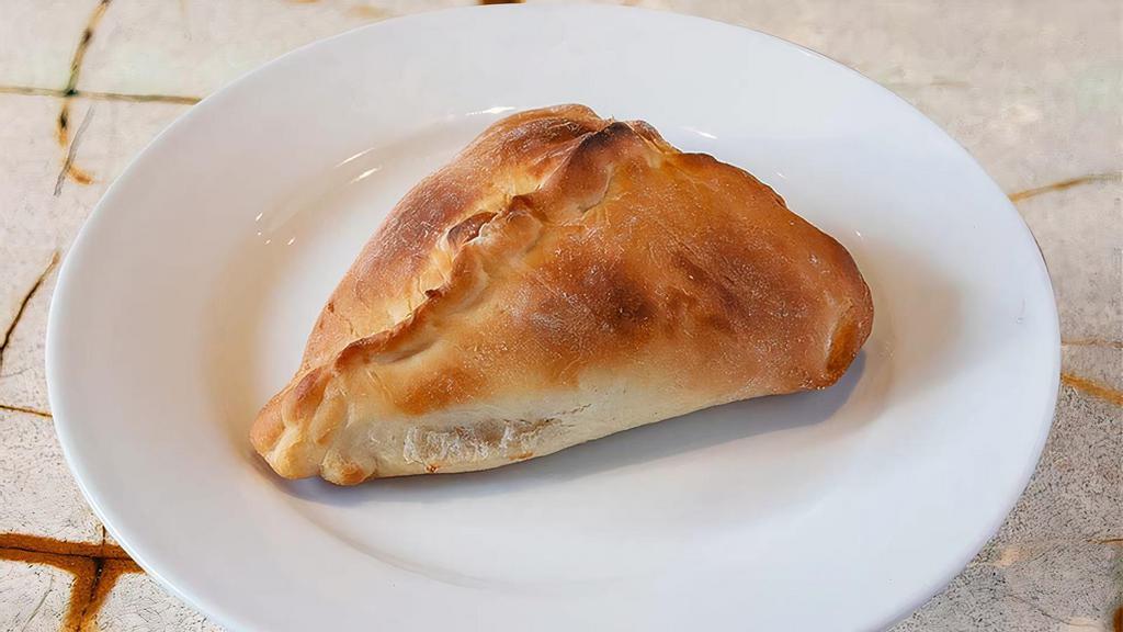 Spinach Fatayer · Fresh spinach soaked with onions, lemon juice and extra virgin olive oil, salt and pepper stuffed in our homemade dough. Vegetarian.