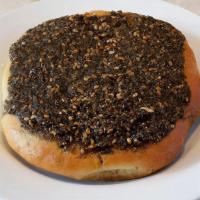 Zaatar · Homemade dough topped with ground thyme, sesame seeds and olive oil. Vegetarian.