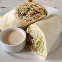 Falafel Wrap · Original hummus, our exclusive falafel made from scratch, served on our house pita bread, to...