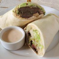 Kafta Sandwich · Original hummus, charbroiled seasoned beef mixed with parsley and onions, served on our hous...