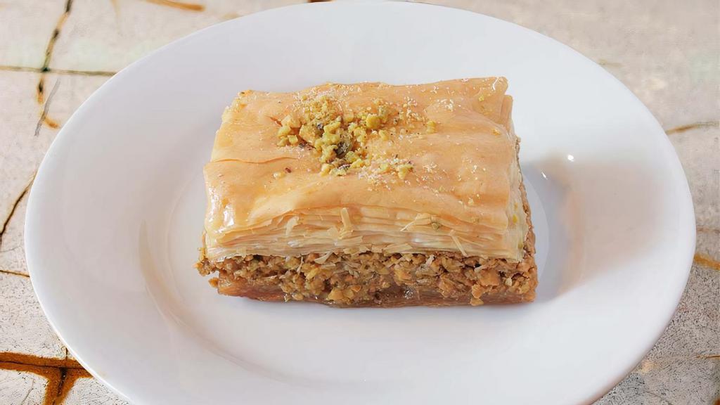 Baklava  · Flaky organic filo dough layered with sweetened walnuts and rosewater, topped with pistachios.