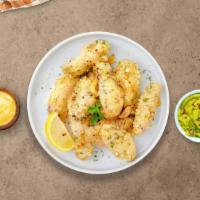 Fuzzy Garlic Parmesan Wings · Fresh chicken wings breaded, fried until golden brown, and tossed in garlic and parmesan. Se...