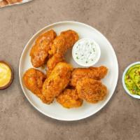 Hot Glaze Wings · Fresh chicken wings breaded, fried until golden brown, and tossed in honey hot sauce. Served...
