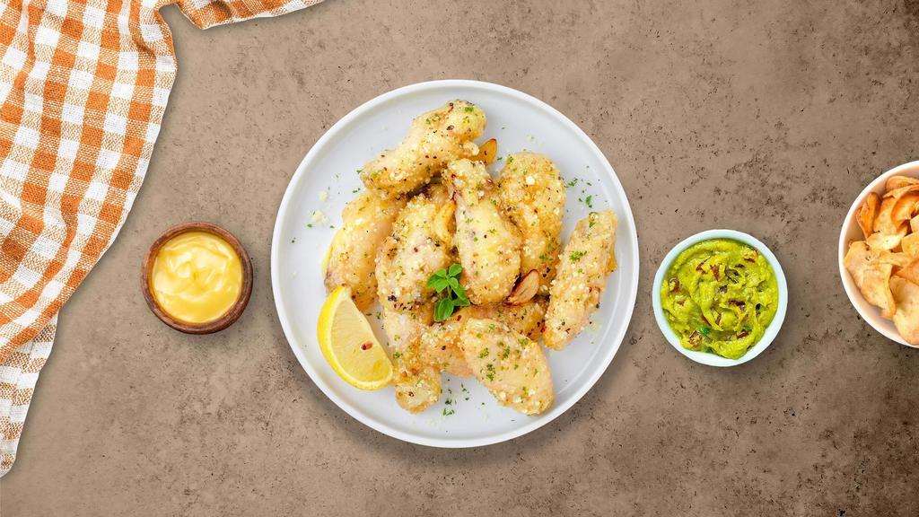 Fuzzy Garlic Parmesan Wings (Boneless) · Fresh boneless chicken wings breaded, fried until golden brown, and tossed in garlic and parmesan. Served with a side of ranch or bleu cheese.