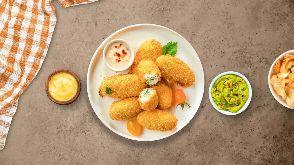 Jalapeño Spicy Poppers · Fresh jalapenos coated in cream cheese and fried until golden brown.