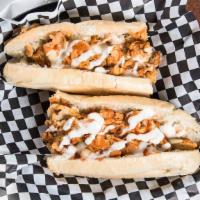 Buffalo Chicken Cheesesteak · Fresh sliced chicken breast chopped on the flat grill mixed with Buffalo sauce and topped wi...