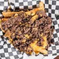 Philly Cheesesteak Fries · Our delicious fries with gooey Cheese Whiz and chopped Ribeye steak on top.