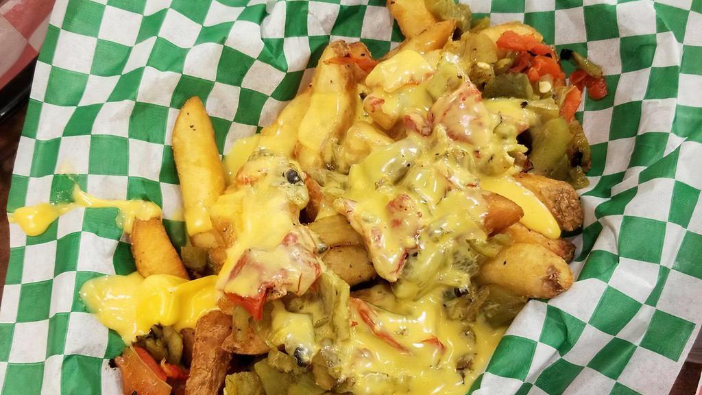 Green Chile Cheese Fries · Our delicious fries with gooey Cheese Whiz and fresh Hatch green chile on top.