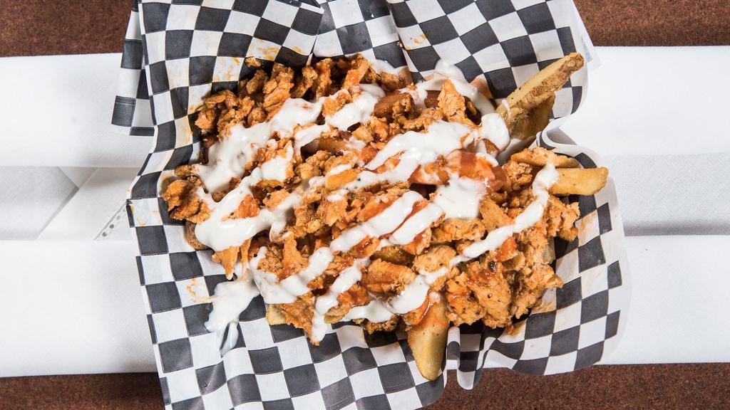 Buffalo Chicken Cheese Fries · Our delicious fries topped with grilled chopped chicken breast, sauted in buffalo sauce and drizzled with blue cheese dressing.
