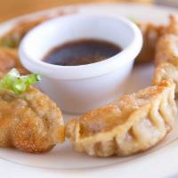 Potstickers (6) · Individually hand made, filled with ground pork, ginger, napa cabbage while folded in a past...