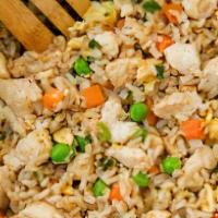 Chicken Fried Rice · Authentic fried rice cooked with egg, peas and carrots, green onions and choice of one item