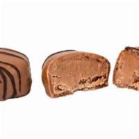 Milk Chocolate Truffles · Our signature smooth and creamy milk chocolate truffles.