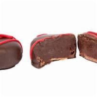 Dark Chocolate Raspberry Truffles · Our signature smooth and creamy dark chocolate truffles made with real raspberry.