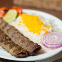 Ground Beef Kebab · Served with Basmati Rice, and salad.