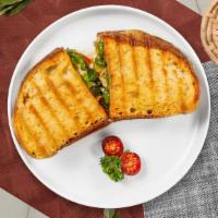 Chicken Pesto Panini · Griddled sandwich with melted mozzarella cheese, grilled chicken, pesto, tomato, on your cho...