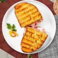 Turkey Panini · Griddled sandwich with turkey, bacon, melty yellow cheddar, tomato, avocado, mayonnaise, and...