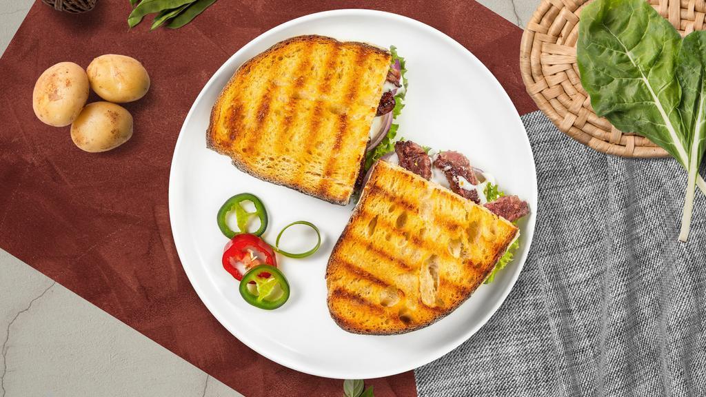 Roast Beef Panini · Griddled sandwich with roast beef, melty yellow cheddar, and your choice of bread.