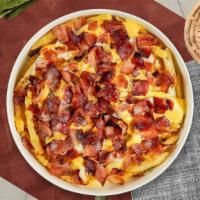 Bacon Cheese Fries · Idaho potato fries cooked until golden brown and garnished with salt, melted cheddar cheese,...