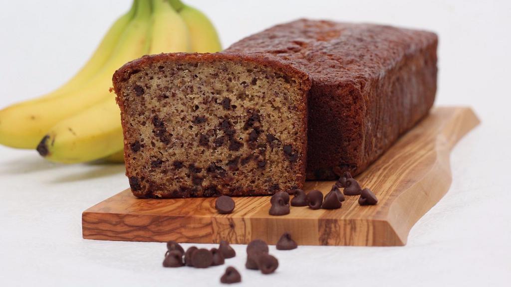 Chocolate Banana Bread · The softness of fresh banana paired with deep rich chocolate chips. Full large loaf ready to slice as you wish. Made in a facility that uses dairy, eggs, and wheat products.