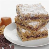 Chocolate Walnut Toffee Bar · Hearty oatmeal, piled with walnuts then smothered in chocolate and spiced toffee topped with...