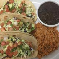Grilled Fish Tacos · Choose between two or three corn tortillas stuffed with grilled fish, shredded cabbage, pico...