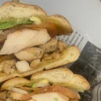 Chicken · Grilled chicken on telera roll filled with Mayo, Tomato, Avocado, and Onion.