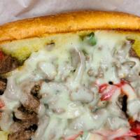 Philly Cheesesteak W/Fries · Grilled steak with sautéed peppers, onion, and provolone cheese. Sandwich or Torta.