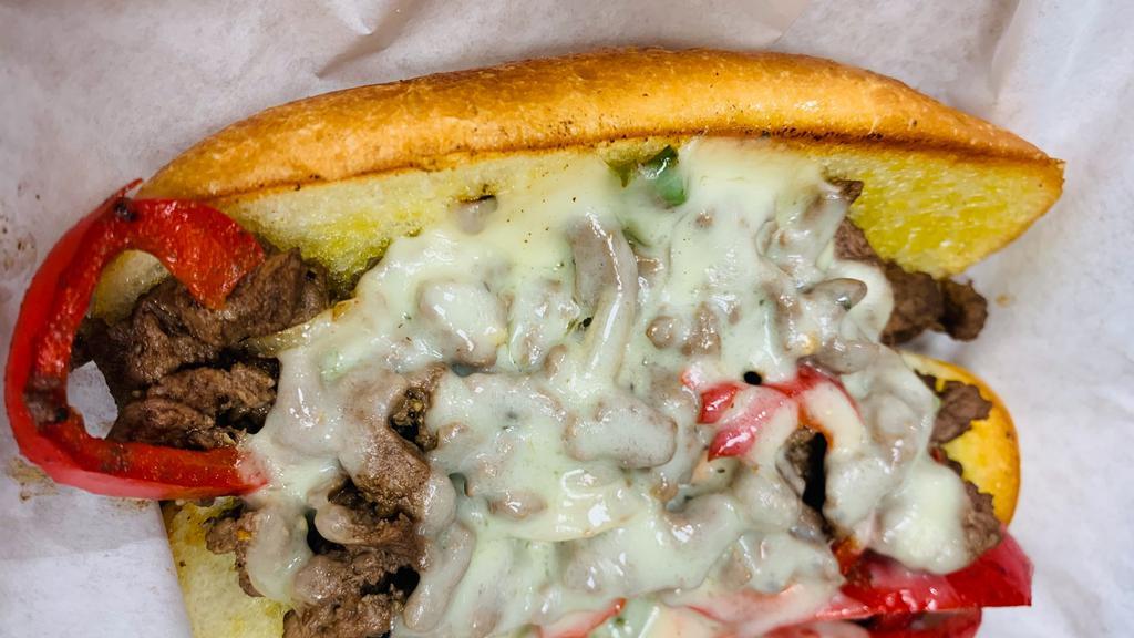 Philly Cheesesteak W/Fries · Grilled steak with sautéed peppers, onion, and provolone cheese. Sandwich or Torta.