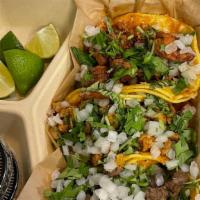 Tacos (4 Tacos / Corn Tortilla)) · Choice of meat , carne asada, pastor pork, carnitas pork or chicken.( Comes w cilantro & oni...