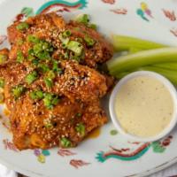Korean Fried Chicken · Boneless fried chicken breast tossed with gochujang hot pepper glaze, with cilantro-avocado ...