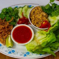 Lettuce Wraps · Ground chicken wok-seared with kung pao sauce, peppers, onions, garlic, ginger, and toasted ...
