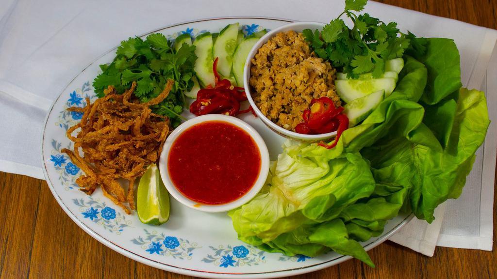 Lettuce Wraps · Ground chicken wok-seared with kung pao sauce, peppers, onions, garlic, ginger, and toasted peanuts.