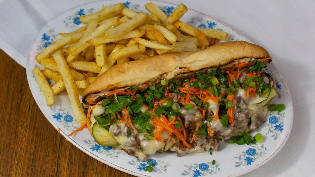 Korean Bbq Philly Cheesesteak · Bulgogi beef, white American cheese, pickled carrots, scallions, and kimchi-mayo on a toasted French roll.