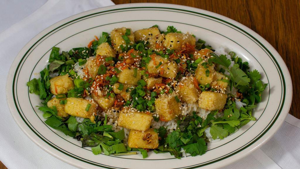 Lemongrass Tofu · Crispy tofu, lemongrass, caramelized ginger, scallion, mint, cilantro, and toasted cashews, with steamed rice.