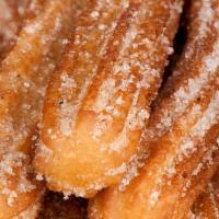 Churro · Fried pastry dusted with cinnamon sugar.