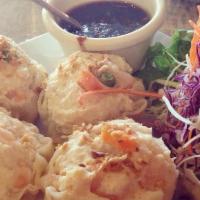 Steam Dumplings · Ground chicken and shrimp, bamboo shoots, onions, and water chestnuts wrapped in wonton pape...