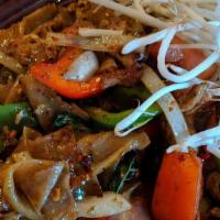 Pad Kee Mao · Fresh wide size rice noodles with egg, ground chili, bell peppers, onions, tomatoes, and bas...
