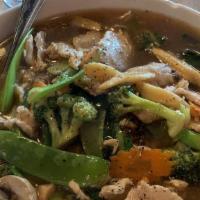 Red Narh · Stir fried wide size rice noodles topped with snow peas, mushrooms, carrots, and broccoli in...