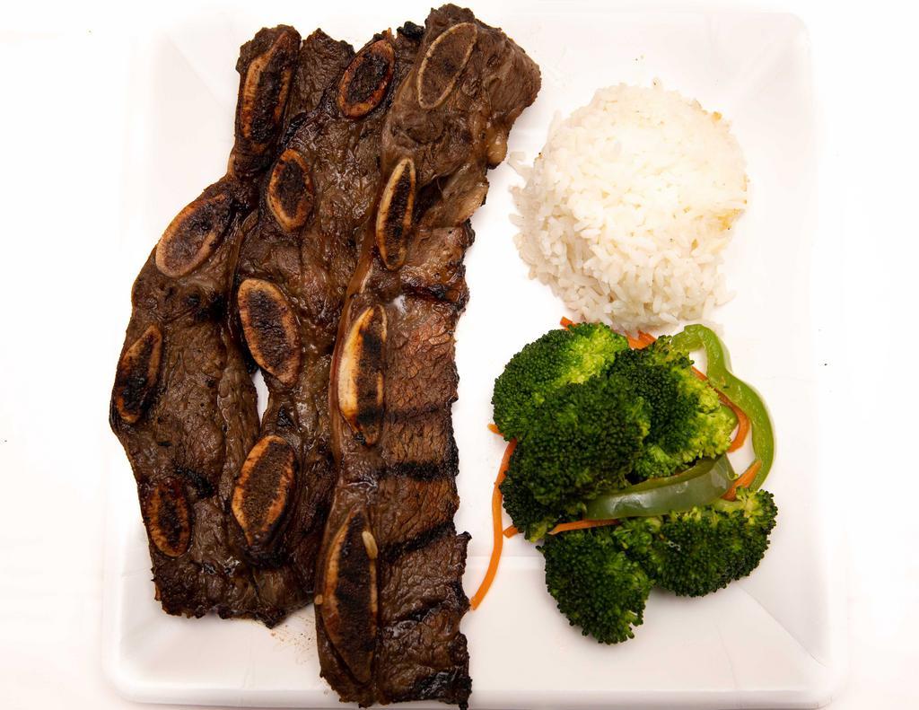 Kalbi Short Ribs Plate Lunch · Beef short ribs cut Korean style, marinated in mama's homemade teriyaki and char-grilled.